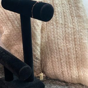 Satya lotus necklace, silver with gold tone finish